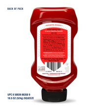 Load image into Gallery viewer, Back view of a red squeeze bottle of Sauerkraut from The Art of Living, Inc., with a black cap and a large white and red product label, on a white background with 'BACK OF PACK' text.