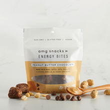 Load image into Gallery viewer, Peanut Butter Chocolate Energy Bites, peanuts, chocolate chips on marble.