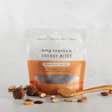 Load image into Gallery viewer, Pumpkin Spice Energy Bites with almond pieces on marble.