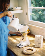Load image into Gallery viewer, A white bag of Beachwood USDA organic coffee by Canyon Coffee in the kitchen with a chemex