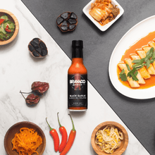 Load image into Gallery viewer, BLACK GARLIC CAROLINA REAPER HOT SAUCE