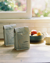 Load image into Gallery viewer, A bag of Afternoon Decaf Coffee by Canyon Coffee at home