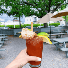 Load image into Gallery viewer, Hand-holding-Bloody mary accompanied with reed straw
