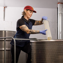 Load image into Gallery viewer, Kate testing cardamom extract at Bittercube