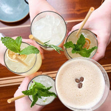 Load image into Gallery viewer, Overhead cheers of multiple drinks with wheat stem straws