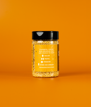 Load image into Gallery viewer, A side view of a bottle of Maple Sea Salt SaladSprinkles showing ways to use the product. The label states flavorful, puffed rice sprinkles that add crunch to your salad, pasta, veggies, even ice cream! #NoMoreCroutons