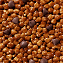 Load image into Gallery viewer, Glossy caramel-coated nuts and chocolate chips mixed together, creating a rich golden-brown confection with dark chocolate accents.