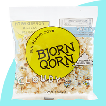 Load image into Gallery viewer, Bjorn Qorn cloudy salty popcorn 1 oz bag on blue background.