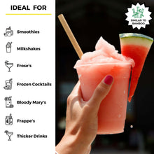 Load image into Gallery viewer, hand holding watermelon iced coctail with reed stem straw
