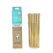 Load image into Gallery viewer, Holy City Straw Co Premium Reusable Reed Straws, 10-count pack, displayed in a glass container. The product is ideal for hot, cold, and frozen drinks, featuring eco-friendly, natural reed material.
