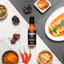 Load image into Gallery viewer, BLACK GARLIC CAROLINA REAPER HOT SAUCE
