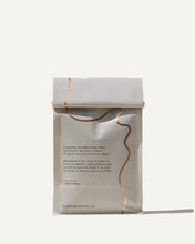 Load image into Gallery viewer, back of the Afternoon Decaf coffee bag packaging with gold foil
