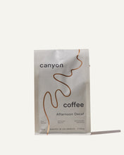 Load image into Gallery viewer, Front of the Afternoon Decaf coffee bag packaging with gold foil 
