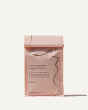 Load image into Gallery viewer, back of bag of Gedeb Whole Bean coffee by Canyon Coffee with gold foil
