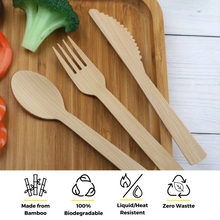 Load image into Gallery viewer, Holy City Straw Co. unwrapped bamboo cutlery on cutting board with eco highlights
