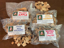 Load image into Gallery viewer, Flame Grilling Products Inc PRE-SOAKED MAINE WOOD CHIPS VARIETY PACK (ONE EACH 6 OZ POUCH) BRANDY APPLE, HONEY WHISKEY MESQUITE, SPICED RUM HICKORY, AND BOURBON BLACK CHERRY
