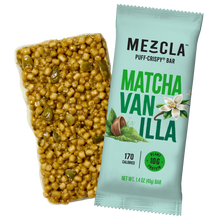 Load image into Gallery viewer, MEZCLA Matcha Vanilla puff-crispy protein bar in light green packaging next to unwrapped bar showing golden puffed grains and seeds
