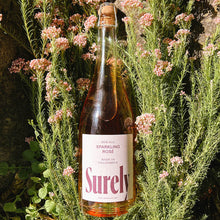 Load image into Gallery viewer, Non-alcoholic Sparkling Rosé Surely Bottle On Flowers
