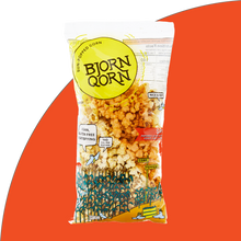 Load image into Gallery viewer, Bjorn Qorn spicy 3oz bag on red background. 
