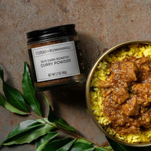 Load image into Gallery viewer, Jar of Ru&#39;s Dark-Roasted Curry Powder next to a bowl of Black Pork Curry
