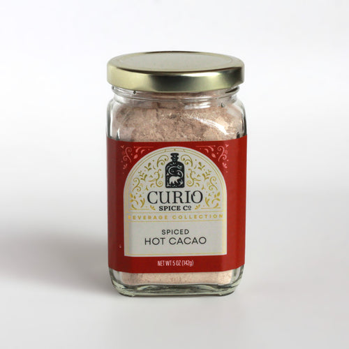 Curio Spice Co. Beverage Blend Spiced Hot Cacao in a glass jar.