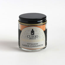 Load image into Gallery viewer, Vietnamese Cassia Cinnamon from Curio Spice in a glass jar.

