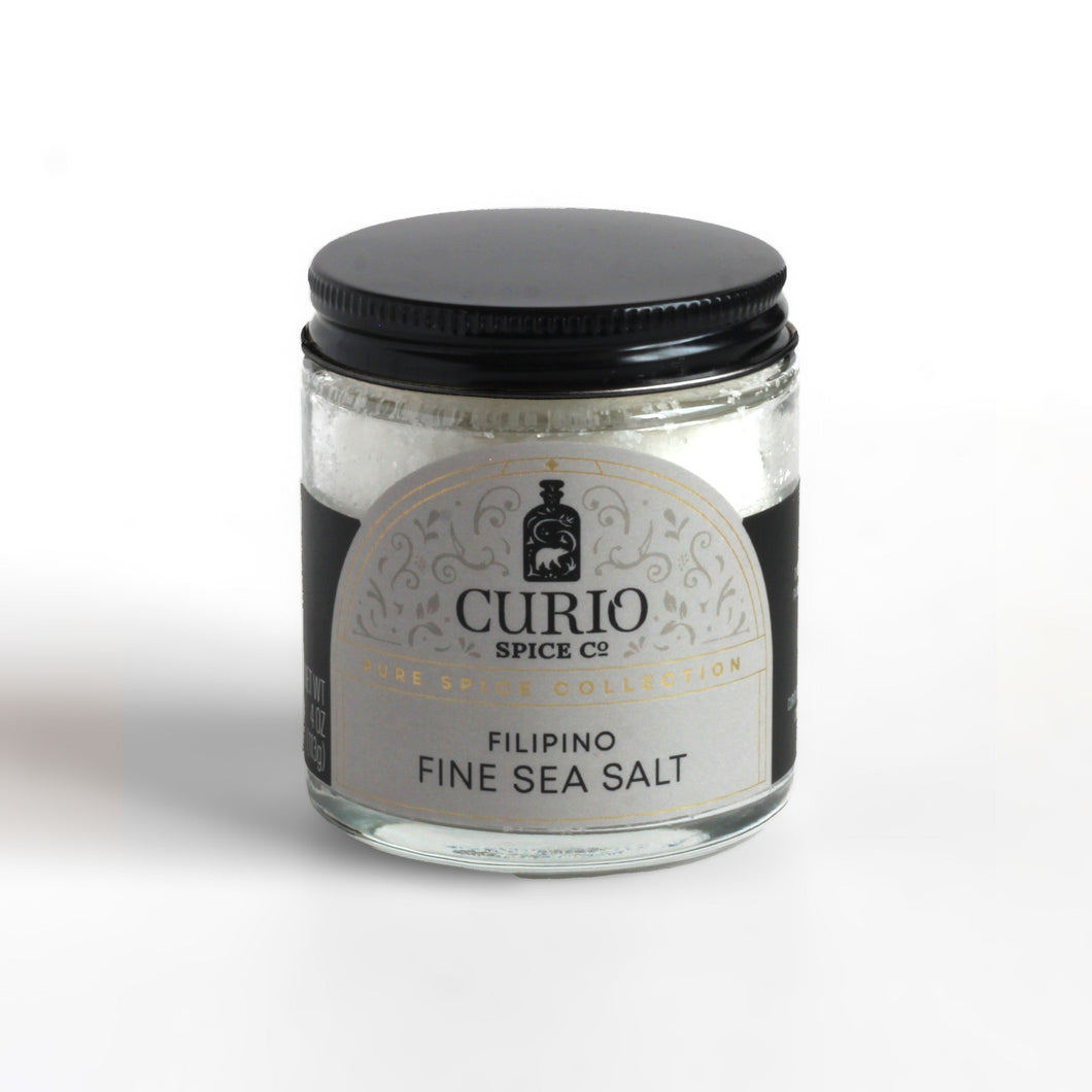 Curio Spice Co. fair-trade single origin sustainable Filipino Fine Sea Salt Fino Asin in a glass jar.