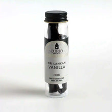 Load image into Gallery viewer, Slim glass jar of Sri Lankan Vanilla beans.
