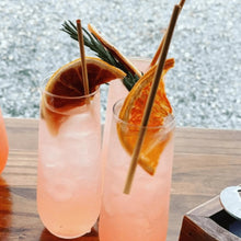 Load image into Gallery viewer, grapefruit infused drinking with orange garnish
