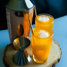 Load image into Gallery viewer, pair of orange infused drink accompanied with mixer
