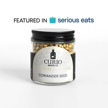 Load image into Gallery viewer, Curio Spice Co. fair-trade single origin sustainable coriander seeds in a glass jar, as featured in Serious Eats.
