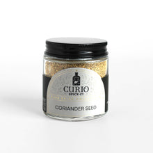 Load image into Gallery viewer, Curio Spice Co. fair-trade single origin sustainable ground coriander seeds in a glass jar.
