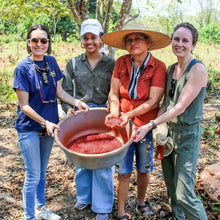 Load image into Gallery viewer, Group photo of Claire, the Founder and Blender-In-Chief of Curio Spice, with harvesters in Colombia.
