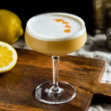 Load image into Gallery viewer, Zenúfana: Golden Sour cocktail sitting on a wooden board
