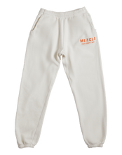 Load image into Gallery viewer, Mezcla sweatpants with Mezcla Puff-Crispy Bar shown towards the top of the left leg
