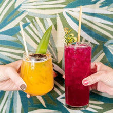 Load image into Gallery viewer, two hand cheersing island and fruit punch cocktail with wheat straw
