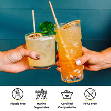 Load image into Gallery viewer, two hands cheersing tropical and citrus cocktail with wheat straw
