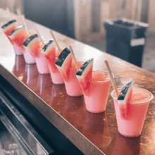 Load image into Gallery viewer, frozen watermelon line of cocktails at bar
