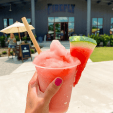 Load image into Gallery viewer, hand holding frozen watermelon drink
